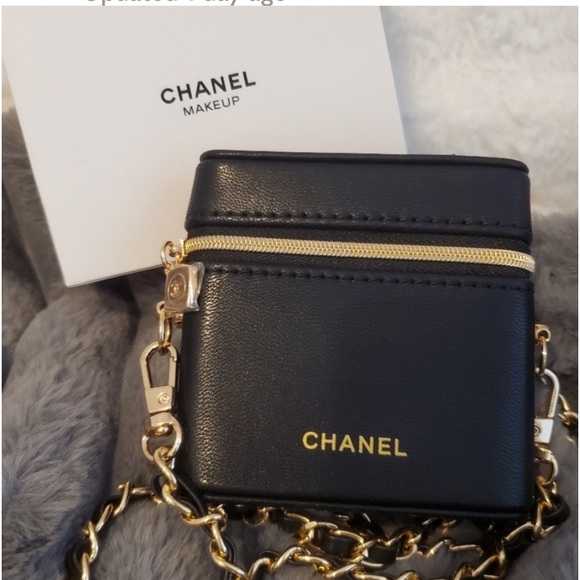 CHANEL Handbags - Authentic New In Box small leather CHANEL purse with mirror and chain.